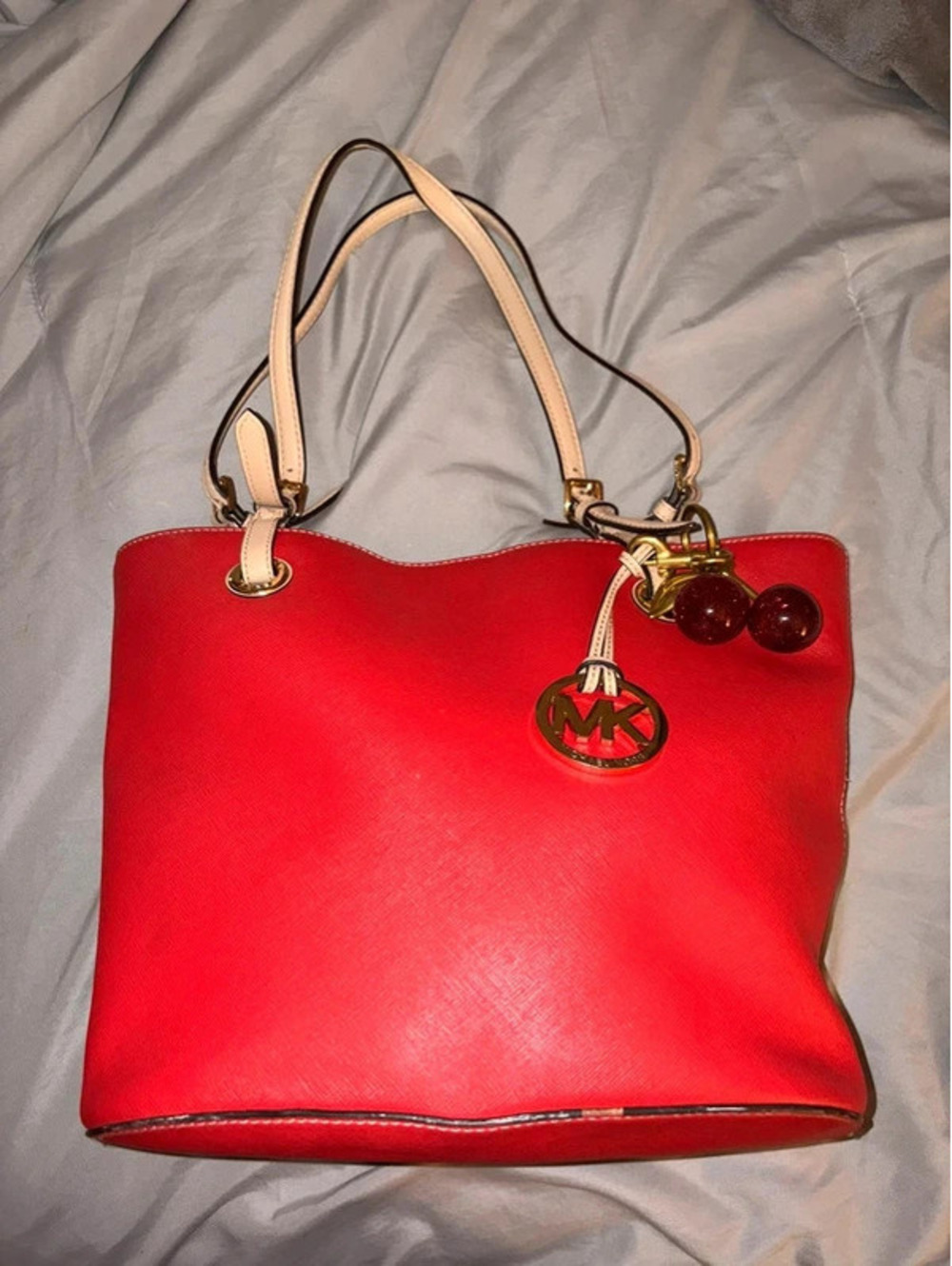 Red Michael Kors Bag with cherry clip